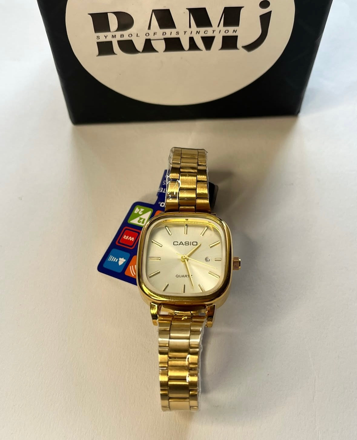 Female Casio square gold x white