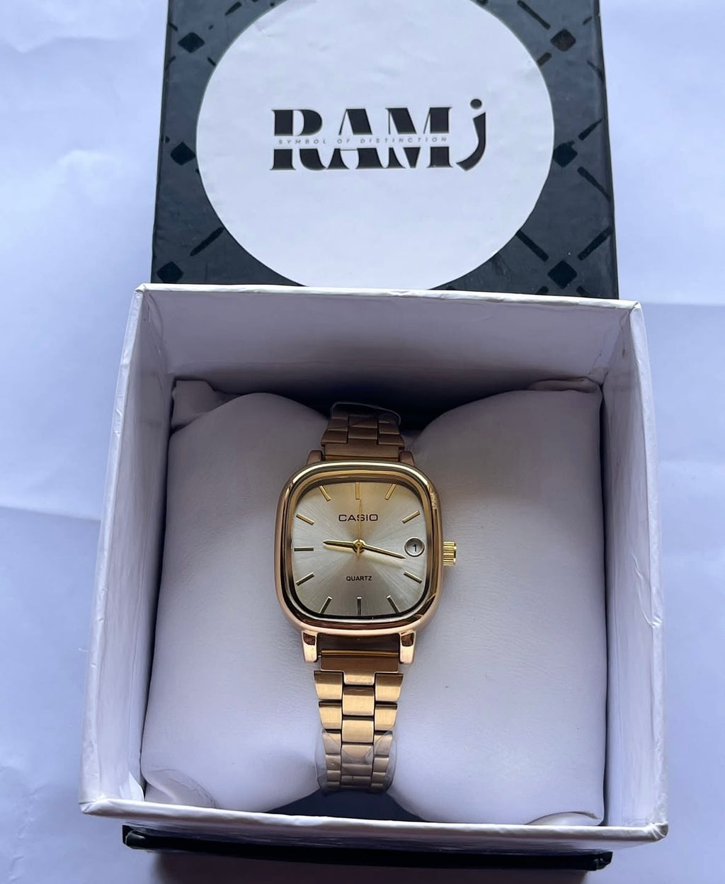 Female Casio square gold x white