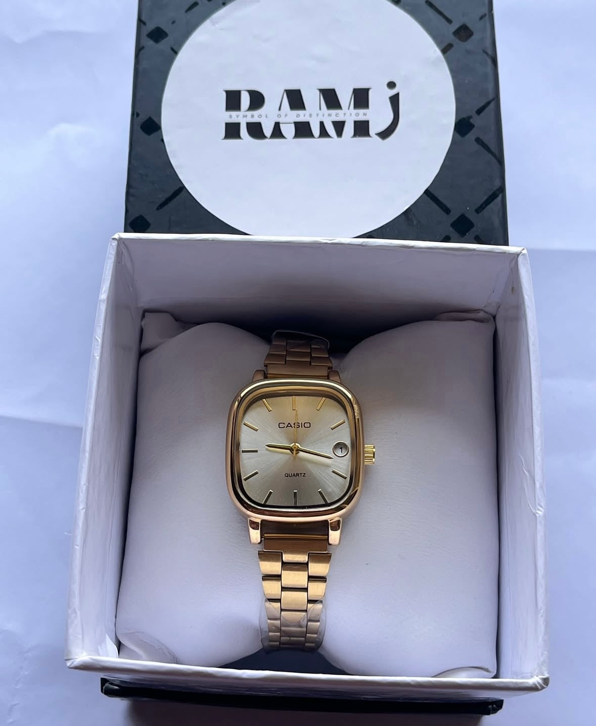 Female Casio square gold x white
